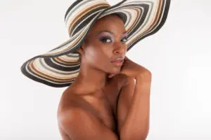 Person wearing striped wide-brimmed sun hat