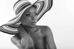 Woman in wide striped sunhat