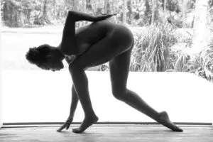 Black-and-white silhouette of person in yoga pose